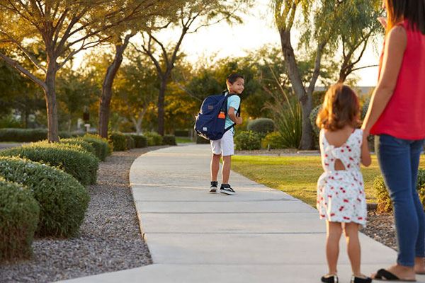 Residents of Alamar community in Avondale, Arizona walking to school