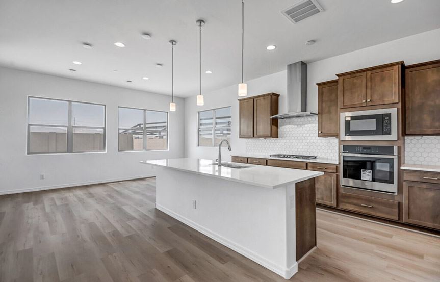 Sandpiper kitchen and dining by Woodside Homes in Alamar community in Avondale, AZ