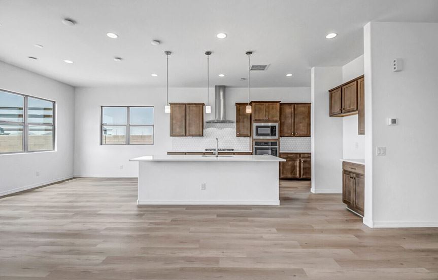 Sandpiper by Woodside Homes Great Room and Kitchen in Alamar community in Avondale, AZ